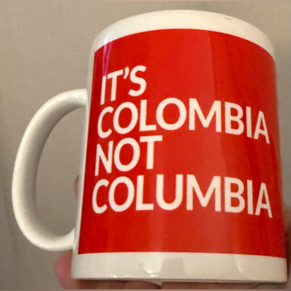 "It's Colombia Not Columbia"  12oz Mug red with white